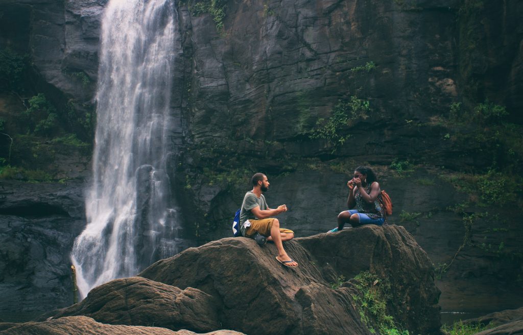 attractive qualities : man and woman at waterfall